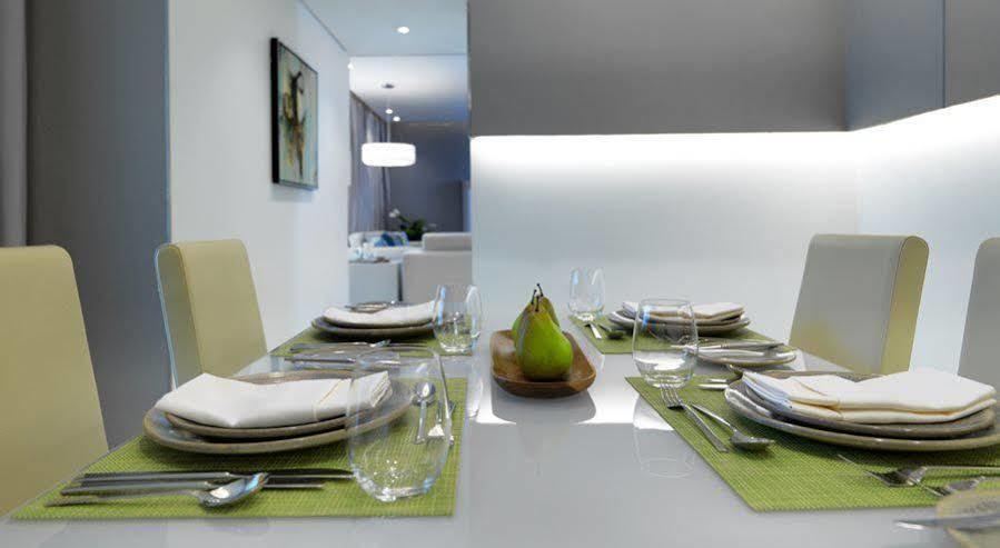Damac Maison The Vogue Dubai Eksteriør billede A table set for a meal