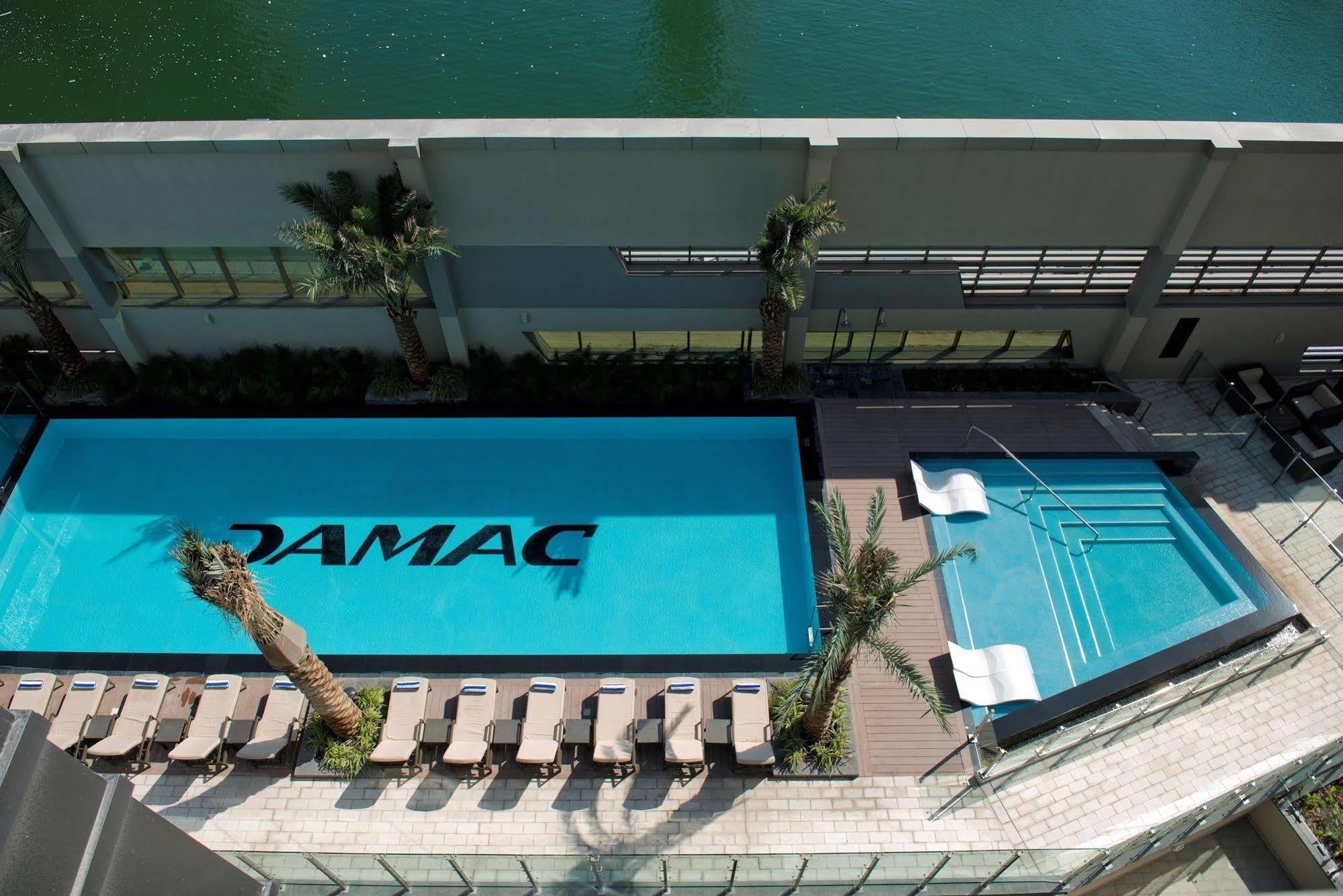 Damac Maison The Vogue Dubai Eksteriør billede The pool at the TAMAC headquarters